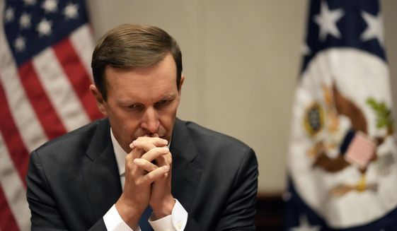 U.S. Senator Chris Murphy (D-CT) listens to a question during a press conference in the U.S. embassy in Belgrade, Serbia, Tuesday, April 19, 2022. A U.S. Senate delegation on Tuesday urged Serbia to join the rest of Europe and impose sanctions against Russia for its bloody carnage in Ukraine. Although Serbia voted in favor of three UN resolutions condemning the Russian aggression against Ukraine, it has not joined international sanctions against Moscow. (AP Photo/Darko Vojinovic)