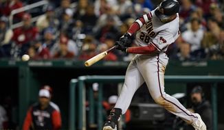 Arizona Diamondbacks&#39; Seth Beer hits a two-run double during the fourth inning against the Washington Nationals in a baseball game at Nationals Park, Wednesday, April 20, 2022, in Washington. (AP Photo/Alex Brandon)