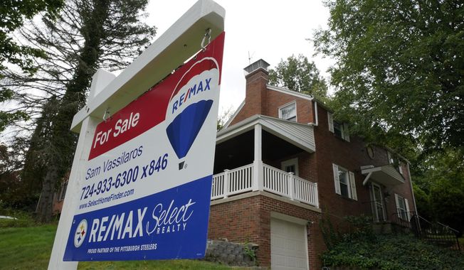 A for sale sign is displayed outside a home in Mount Lebanon, Pa., on Tuesday, Sept. 21, 2021. (AP Photo/Gene J. Puskar, File)