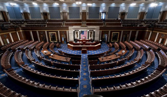 The chamber of the House of Representatives is seen at the Capitol in Washington, Feb. 28, 2022. Just seven Republicans, along with most Democrats, used remote voting in the House when it began two years ago as the pandemic erupted. As of April 2022, over half of GOP lawmakers used the proxy voting system at least once, along with nearly all Democrats. More than 50 of the Republicans who鈥檝e used it this year also once signed onto a lawsuit seeking to declare the practice unconstitutional. (AP Photo/J. Scott Applewhite, File)  **FILE**