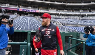 Washington Nationals relief pitcher Sean Doolittle takes the field for a baseball workout at Nationals Park, Wednesday, April 6, 2022, in Washington. The Washington Nationals and the New York Mets are scheduled to play on opening day, Thursday. (AP Photo/Alex Brandon) **FILE**