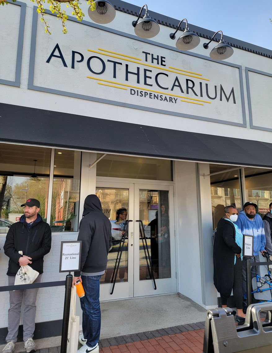 The Apothecarium Dispensary in Maplewood was one of 13 sites across New Jersey that opened its doors to recreational marijuana customers for the first time Thursday. Medical marijuana customers who have used the dispensary for months enjoyed their own line while new, recreational customers waited in a longer queue that spilled into an overflow area across the street. (Tom Howell Jr./The Washington Times)