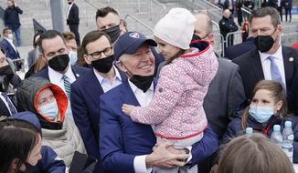 President Joe Biden meets with Ukrainian refugees during a visit to PGE Narodowy Stadium, March 26, 2022, in Warsaw. The Biden administration is making it easier for refugees fleeing Russia’s war on Ukraine to come to the United States from Europe while trying to shut down an informal route through Northern Mexico that has emerged in recent weeks. (AP Photo/Evan Vucci, File)