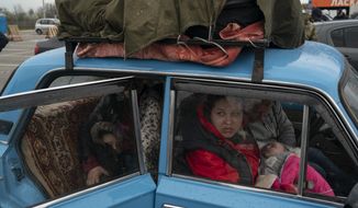Internally displaced people from Mariupol and nearby towns arrive at a refugee center fleeing from the Russian attacks, in Zaporizhzhia, Ukraine, Thursday, April 21, 2022. Mariupol, which is part of the industrial region in eastern Ukraine known as the Donbas, has been a key Russian objective since the Feb. 24 invasion began. (AP Photo/Leo Correa)