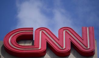 Signage is seen at CNN center, Thursday, April 21, 2022, in Atlanta. CNN’s brand-new streaming service, CNN+, is shutting down only a month after launch. In a Thursday memo, incoming CNN chief executive Chris Licht said the service would shut down at the end of April.   (AP Photo/Mike Stewart)