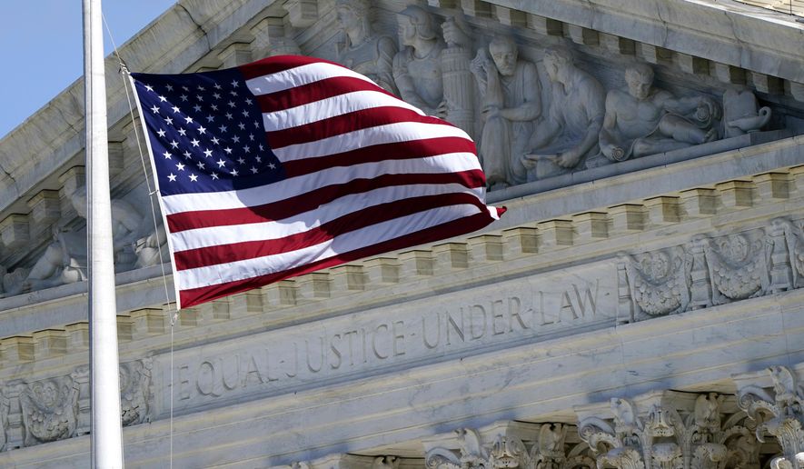 FILE - An American flag waves in front of the Supreme Court building, Nov. 2, 2020, on Capitol Hill in Washington. (AP Photo/Patrick Semansky, File)