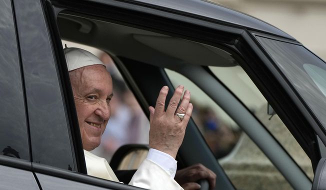 Pope Francis waves as he leaves his weekly general audience in St. Peter&#x27;s Square, at the Vatican, Wednesday, April 20, 2022. (AP Photo/Alessandra Tarantino)