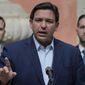Florida Gov. Ron DeSantis speaks during a news conference, Feb. 1, 2022, in Miami.  Prosecutors will no longer pursue illegal voter registration charges against a Tennessee woman who had been granted a new trial after she challenged her jury conviction, a district attorney said Friday, April 22, 2022. (AP Photo/Rebecca Blackwell, file)