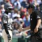 Washington Nationals&#39; Lucius Fox, left, and home plate umpire Mark Ripperger, right, chat after Fox was called out on strikes during the eighth inning of a baseball game against the San Francisco Giants, Saturday, April 23, 2022, in Washington. The Giants won 5-2.(AP Photo/Nick Wass)