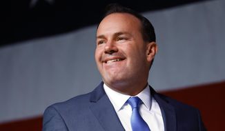 Senator Mike Lee, R-Utah, walks onto stage to give his candidacy speech during the GOP Convention at the Mountain America Convention Center in Sandy, Utah, on Saturday, April 23, 2022. (Adam Fondren/The Deseret News via AP)