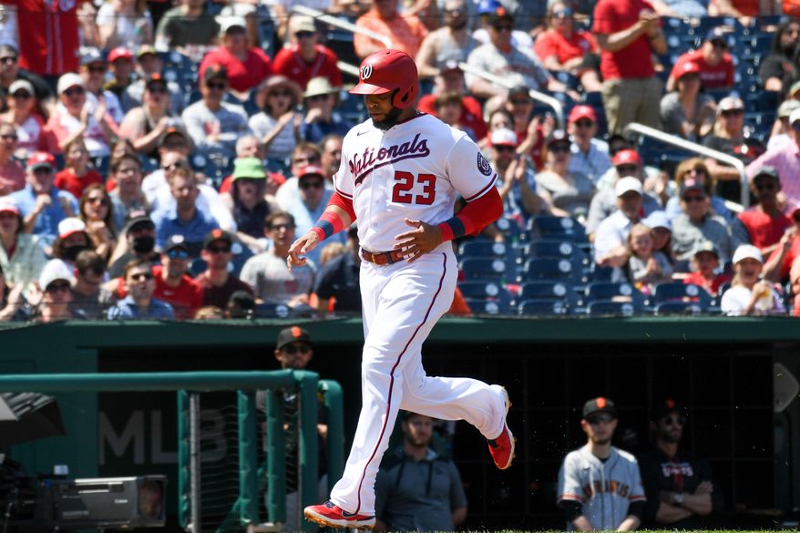 Washington Nationals designated hitter Nelson Cruz (23) running home after a being driven in by a single by  left fielder Yadiel Hernandez (29) during the 1st inning in a game against the San Francisco Giants