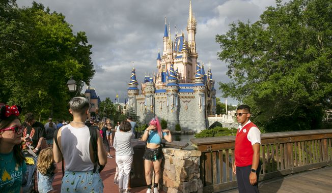 People visit Magic Kingdom Park at Walt Disney World Resort in Lake Buena Vista, Florida, on Friday, April 22, 2022. (AP Photo/Ted Shaffrey)