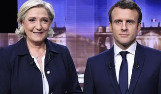 FILE- French presidential election candidate for the far-right Front National party, Marine Le Pen, left, and French presidential election candidate for the En Marche ! movement, Emmanuel Macron, pose prior to the start of a live broadcast face-to-face televised debate in La Plaine-Saint-Denis, north of Paris, May 3, 2017. It&#39;s meant to be the climax of France&#39;s presidential campaign. Centrist French President Emmanuel Macron and far-right contender Marine Le Pen are facing each other Wednesday April 20, 2022 evening in a one-on-one televised debate that promises to be challenging for both of them _ and may be decisive ahead of Sunday&#39;s runoff vote. (Eric Feferberg/Pool Photo via AP, file)