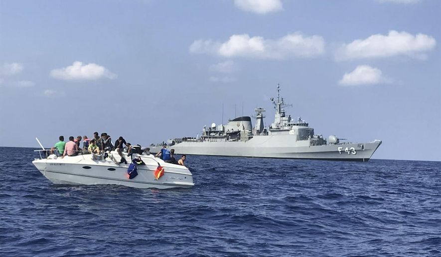 In this photo by United Nations Interim Force in Lebanon (UNIFIL), UNIFIL&#39;s flagship, BRS Liberal, approaches a boat overcrowded with migrants in the Mediterranean Sea on Oct. 12, 2018. The Lebanese army Sunday, April 24, 2022, recovered the bodies of eight migrants whose boat carrying more than 50 people capsized the night before, raising the death toll to nine, state media reported. (UNIFIL via AP, File)