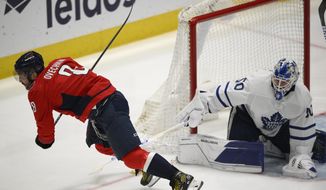 Washington Capitals left wing Alex Ovechkin (8) is tripped by Toronto Maple Leafs goaltender Erik Kallgren (50) during the third period of an NHL hockey game, Sunday, April 24, 2022, in Washington. Ovechkin left with an injury after the play. (AP Photo/Nick Wass) **FILE**