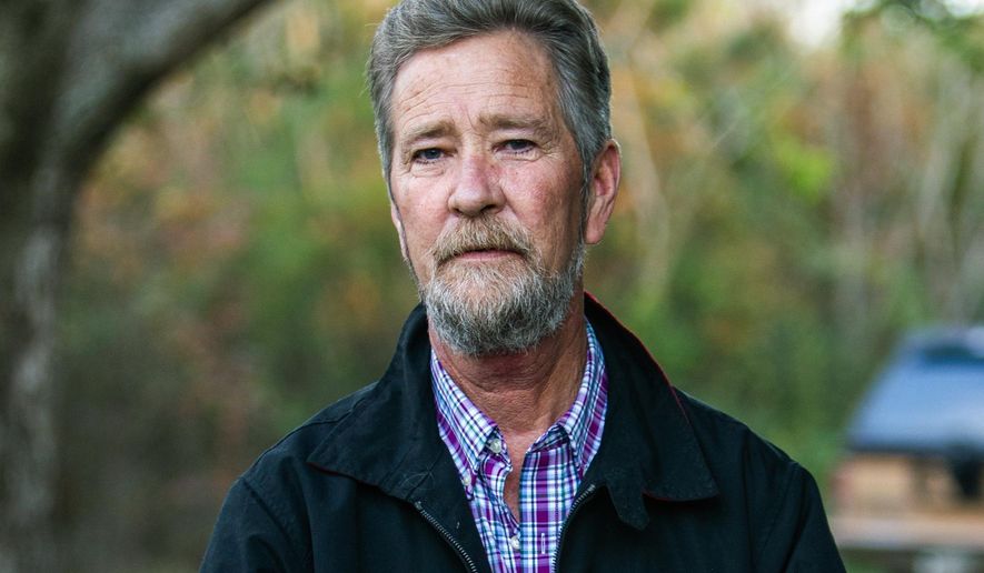 Leslie McCrae Dowless Jr. poses for a portrait outside of his home in Bladenboro, N.C., Dec. 5, 2018. Dowless, the key player in a North Carolina absentee-ballot fraud case that led to a new congressional election, died Sunday, April 24, 2022, his family announced. (Travis Long/The News &amp;amp; Observer via AP, File)