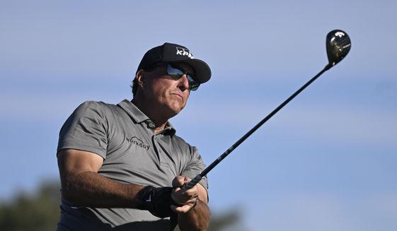 Phil Mickelson hits his tee shot on the fifth hole of the South Course at Torrey Pines during the first round of the Farmers Insurance Open golf tournament Jan. 26, 2022, in San Diego. Mickelson has said he has asked for a release from the PGA Tour for the option to play in the Saudi-funded LIV Golf Invitational in England. (AP Photo/Denis Poroy, File) **FILE**