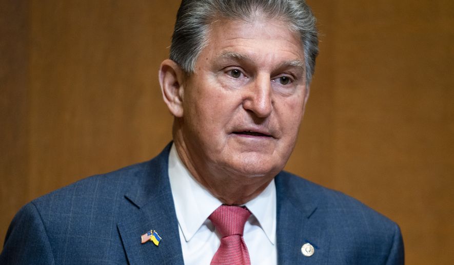 Sen. Joe Manchin, D-W.Va., arrives for a Senate Appropriations Subcommittee on Commerce, Justice, Science, and Related Agencies hearing to discuss the fiscal year 2023 budget of the Department of Justice at the Capitol in Washington, Tuesday, April 26, 2022. (Greg Nash/Pool Photo via AP)