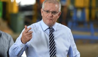Australian Prime Minister Scott Morrison speaks at a press conference after visiting a steel fabrication company in Townsville, Tuesday, April 26, 2022. The opposition Labor Party has criticized Morrison&#39;s conservative government over a security pact announced last week between China and the Solomon Islands. (Mick Tsikas/AAP Image via AP)