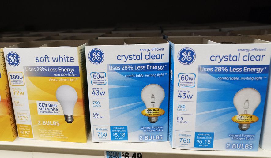 General Electric lightbulbs are displayed in a supermarket on April 5, 2021, in New York. The Biden administration is scrapping old-fashioned incandescent lightbulbs. Rules finalized by the Energy Department will require manufacturers to sell energy-efficient lightbulbs, accelerating a longtime industry practice to use compact fluorescent and LED bulbs that last 25 to 50 times longer than incandescent bulbs. (AP Photo/Mark Lennihan) ** FILE **