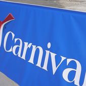 This Jan. 29, 2021 file photo shows a Carnival Cruise Line sign at PortMiami in Miami.  Carnival Corp. will soon get a new CEO at the helm of the cruise line operator. The company said Tuesday, April 26, 2022,  that CEO Arnold Donald will step down on Aug. 1 and be replaced by Josh Weinstein, a longtime Carnival executive.   (AP Photo/Lynne Sladky, File)