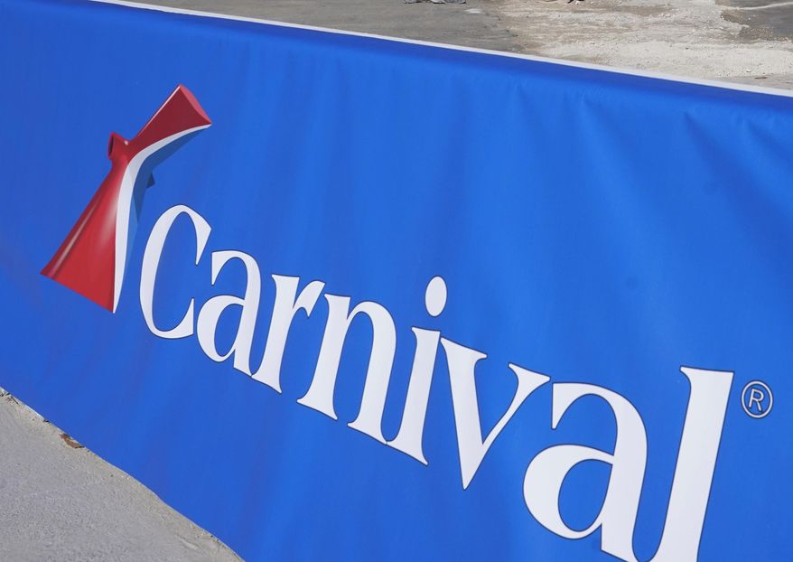 This Jan. 29, 2021 file photo shows a Carnival Cruise Line sign at PortMiami in Miami. Carnival Corp. will soon get a new CEO at the helm of the cruise line operator. The company said Tuesday, April 26, 2022, that CEO Arnold Donald will step down on Aug. 1 and be replaced by Josh Weinstein, a longtime Carnival executive. (AP Photo/Lynne Sladky, File)