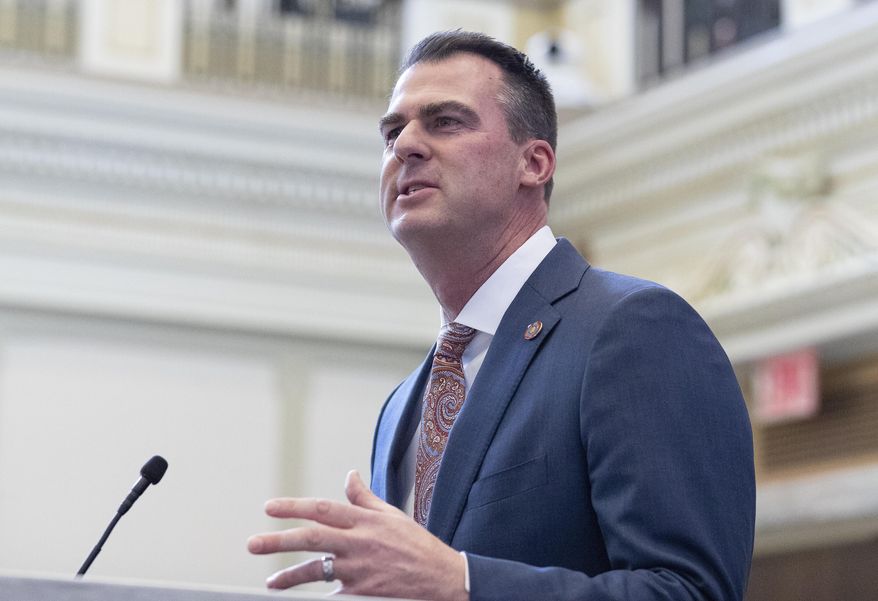 FILE - Oklahoma Gov. Kevin Stitt delivers his State of the State address in Oklahoma City, on Monday, Feb. 7, 2022. Stitt has signed a bill prohibiting the use of nonbinary gender markers on state birth certificates. The first-term Republican signed the bill Tuesday, April 26, 2022. (AP Photo/Alonzo Adams, File)