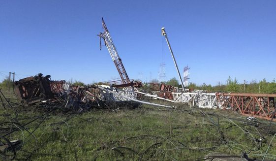 In this photograph released by the Press Center of the Ministry of Internal Affairs of the Pridnestrovian Moldavian Republic, destroyed radio antennas lie on the ground in Maiac, in the Moldovan separatist region of Trans-Dniester, Tuesday, April 26, 2022. Police in the Moldovan separatist region of Trans-Dniester say two explosions on Tuesday morning in a radio facility close to the Ukrainian border knocked two powerful antennas out of service just a day after several explosions believed to be caused by rocket-propelled grenades were reported to have hit the Ministry of State Security in the city of Tiraspol, the region&#39;s capital (Press Center of the Ministry of Internal Affairs of the Pridnestrovian Moldavian Republic via AP, HO)