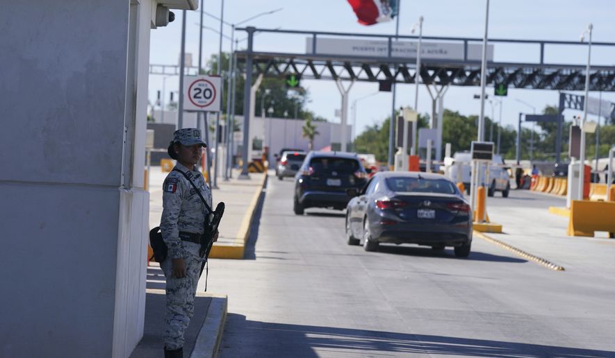 A Mexican soldier patrols the international border bridge that connects Del Rio, Texas and Ciudad Acuna, Mexico, after its partial reopening, Sept. 25, 2021. A federal judge in Louisiana has on Wednesday, April, 27, 2022, ordered the Biden administration to stop phasing out a public health rule that allows the expulsion of migrants without an opportunity to seek asylum. (AP Photo/Fernando Llano, File)