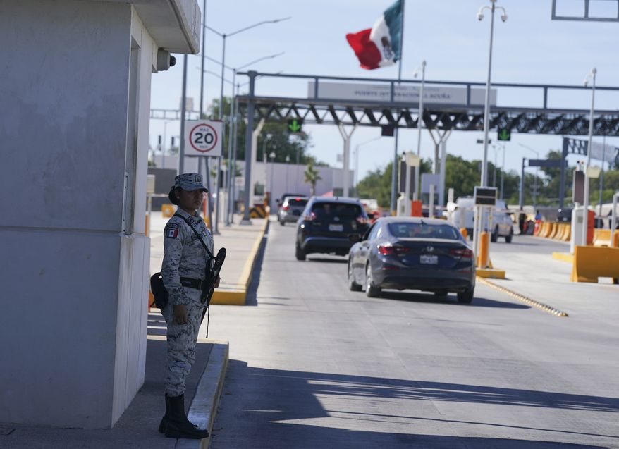 A Mexican soldier patrols the international border bridge that connects Del Rio, Texas and Ciudad Acuna, Mexico, after its partial reopening, Sept. 25, 2021. A federal judge in Louisiana has on Wednesday, April, 27, 2022, ordered the Biden administration to stop phasing out a public health rule that allows the expulsion of migrants without an opportunity to seek asylum. (AP Photo/Fernando Llano, File)