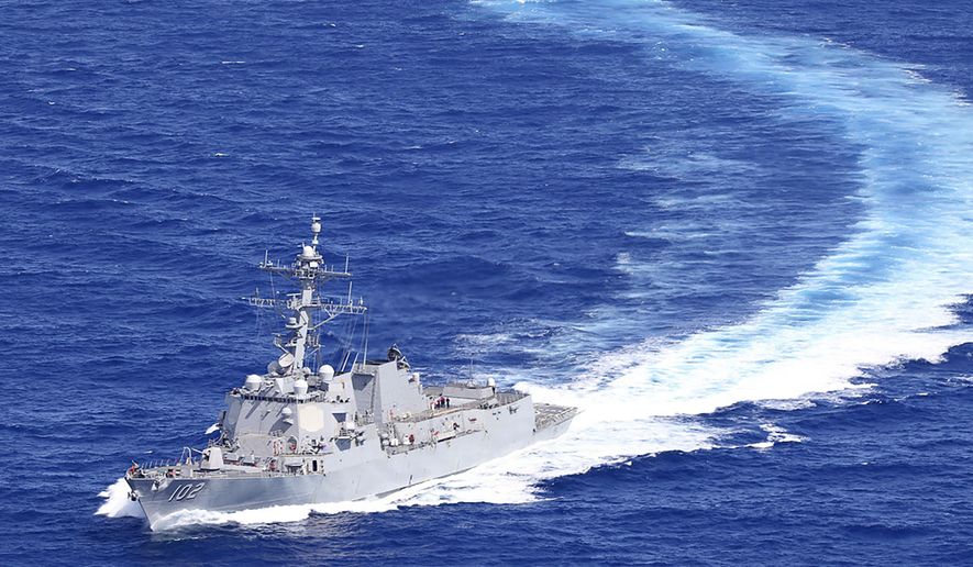 The Arleigh Burke-class guided-missile destroyer USS Sampson (DDG 102) is underway as it is positioned to conduct lifesaving actions in support of disaster relief efforts in Tonga on Jan. 25, 2022. China protested Wednesday, April 27, 2022, against the sailing of a U.S. Navy guided-missile destroyer through the Taiwan Strait the previous day, accusing the American side of hyping the maneuver.(Naval Aircrewmen 2nd Class John Allen/U.S. Navy via AP)