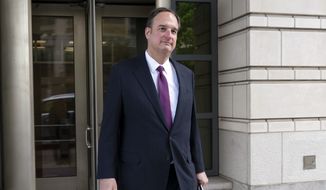 Attorney Michael Sussmann who was charged with lying to the FBI during the Trump-Russia investigation leaves the federal court in Washington, Wednesday, April 27, 2022. (AP Photo/Jose Luis Magana) ** FILE **