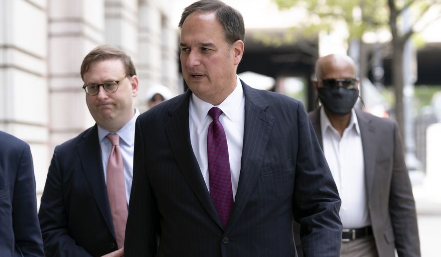 Attorney Michael Sussmann who was charged with lying to the FBI during the Trump-Russia investigation arrives at federal court in Washington, Wednesday, April 27, 2022. (AP Photo/Jose Luis Magana)
