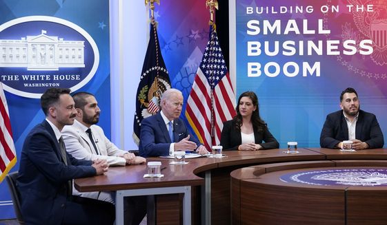 President Joe Biden, third from left, speaks as he meets with small business owners in the South Court Auditorium on the White House complex in Washington, Thursday, April 28, 2022. Joining Biden is from left, Jeff Yerxa, co-founder of Lost Sock Roasters, Nicolas Cabrera, co-founder of Lost Sock Roasters, Jennifer Arniella, owner of Unique Crafts by Jenn and Edward Garcia III, co-founder of The Box Street Social. (AP Photo/Susan Walsh)