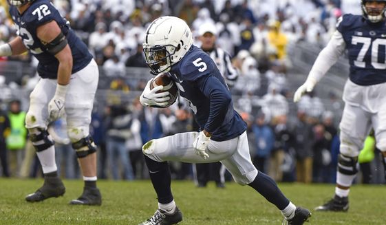 Penn State wide receiver Jahan Dotson (5) runs following a catch against Penn State during an NCAA college football game in State College, Pa., Nov. 13, 2021. Dotson was selected by the Washington Commanders during the first round of the NFL draft Thursday, April 28. (AP Photo/Barry Reeger, File) **FILE**