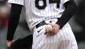 Chicago White Sox starting pitcher Dylan Cease grips the ball as he get the sign in a baseball game against the Kansas City Royals Wednesday, April 27, 2022, in Chicago. (AP Photo/Charles Rex Arbogast **FILE**