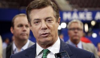 In this July 17, 2016 file photo, then-Donald Trump campaign chairman Paul Manafort talks to reporters on the floor of the Republican National Convention, in Cleveland. The Justice Department filed a lawsuit Thursday, April 28, 2022, against Donald Trump&#39;s former campaign chairman Paul Manafort — who was convicted in special counsel Robert Mueller’s Russia investigation and later pardoned — seeking to recover nearly $3 million from undeclared foreign bank accounts. (AP Photo/Matt Rourke) **FILE**