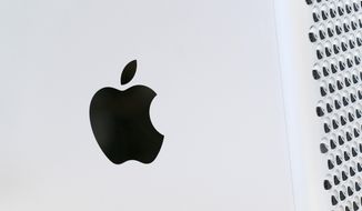 This May 21, 2021, photo shows the Apple logo displayed on a Mac Pro desktop computer in New York. Apple on Thursday, April 28, 2022, reported quarterly results that topped analysts&#39; projections despite supply shortages, economic fallout from the Russia-Ukraine war and a growth comedown from the huge sales lift that technology products and service got from pandemic restrictions. (AP Photo/Mark Lennihan, File)