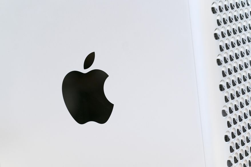 This May 21, 2021, photo shows the Apple logo displayed on a Mac Pro desktop computer in New York. Apple on Thursday, April 28, 2022, reported quarterly results that topped analysts' projections despite supply shortages, economic fallout from the Russia-Ukraine war and a growth comedown from the huge sales lift that technology products and service got from pandemic restrictions. (AP Photo/Mark Lennihan, File)