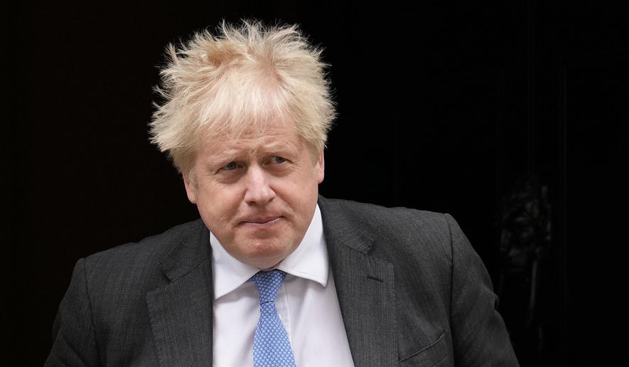 British Prime Minister Boris Johnson leaves 10 Downing Street to attend the weekly Prime Minister&#39;s Questions at the Houses of Parliament, in London, Wednesday, April 27, 2022. (AP Photo/Matt Dunham)