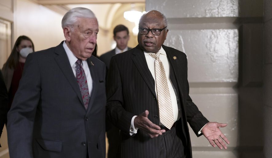 House Majority Leader Steny Hoyer, D-Md., left, and House Majority Whip James Clyburn, D-S.C., talk on their way to a House Democratic Caucus meeting, at the Capitol in Washington, Tuesday, April 5, 2022. (AP Photo/J. Scott Applewhite) **FILE**
