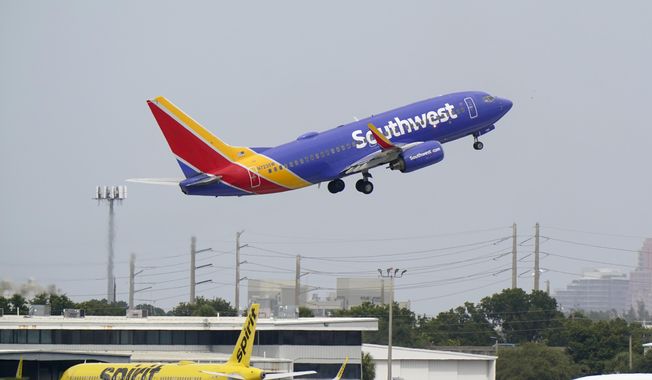A Southwest Airlines Boeing 737-7H4 takes off, Tuesday, Oct. 20, 2020, from Fort Lauderdale-Hollywood International Airport in Fort Lauderdale, Fla. (AP Photo/Wilfredo Lee) ** FILE **