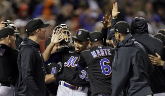 New York Mets pitcher Edwin Diaz (39) celebrates with teammates after a baseball game against the Philadelphia Phillies on Friday, April 29, 2022, in New York. The Mets won 3-0 on a combined no-hitter. (AP Photo/Adam Hunger)