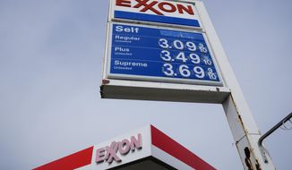 FILE - This April 28, 2021 photo shows an Exxon service station sign in Philadelphia. Exxon Mobil reported $5.48 billion in profits during the first quarter, Friday, April 29, 2022, as oil and gas prices rose steadily, more than doubling its profits compared to the same quarter last year.  (AP Photo/Matt Rourke, File)