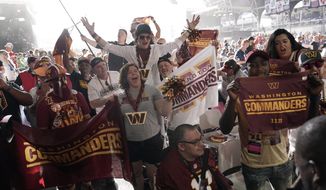 Washington Commanders fans cheer during the second round of the NFL football draft Friday, April 29, 2022, in Las Vegas. (AP Photo/Jae C. Hong)
