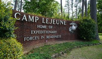 The main gate to Camp Lejeune Marine Base outside Jacksonville, N.C., is shown on Friday, April 29, 2022. Former Marine Willy Cancel, who was killed Monday in Ukraine, was once stationed here. (AP Photo/Allen G. Breed)