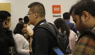 Guests gather to check out Xiaomi&#39;s newly launched products at an event in Bangalore, India, Tuesday, Sept. 17, 2019. Indian authorities on Saturday, April 30, 2022, seized $725 million from Chinese smartphone company Xiaomi after an investigation found it had broken the country&#39;s foreign exchange laws by making illegal remittances abroad, officials said. (AP Photo/Aijaz Rahi, File)