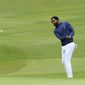 North Carolina A&amp;T&#39;s J.R. Smith hits onto the 18th green during the first round of the Phoenix Invitational golf tournament in Burlington, N.C., Monday, Oct. 11, 2021. (AP Photo/Gerry Broome) **FILE**