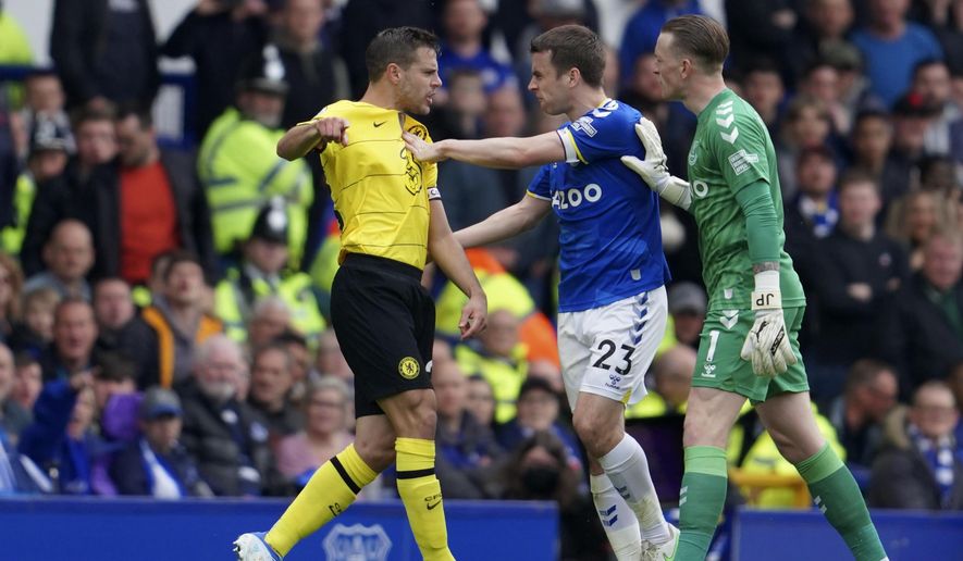 Everton&#x27;s goalkeeper Jordan Pickford, right, watches Everton&#x27;s Seamus Coleman, center, argues with Chelsea&#x27;s Cesar Azpilicueta during the Premier League soccer match between Everton and Chelsea at Goodison Park in Liverpool, England, Sunday, May 1, 2022. (AP Photo/Jon Super)