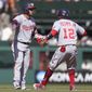 Washington Nationals&#39; Yadiel Hernandez, left, is congratulated by first base coach Eric Young Jr. (12) after hitting a three-run double against the San Francisco Giants during the eighth inning of a baseball game in San Francisco, Sunday, May 1, 2022. (AP Photo/Jeff Chiu)